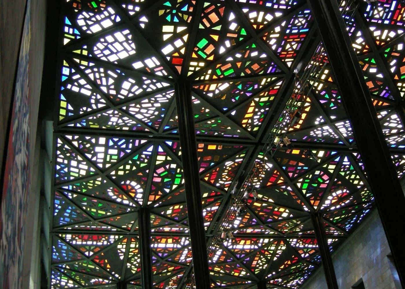 The coloured glass ceiling of the Great Hall at NGV International